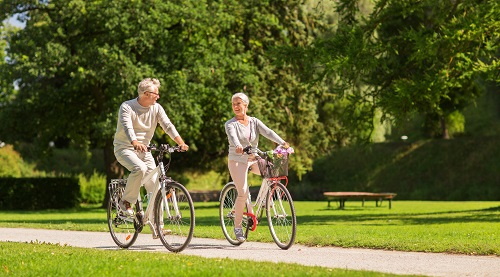 This image: A couple enjoying a bike ride through a park.
					 	The map:  The areas for the site with highlighted roads establishing the access points.